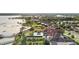 An aerial view features a neighborhood with lake access, private docks, and beautiful waterfront homes at 14724 Avenue Of The Rushes, Winter Garden, FL 34787