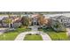Aerial view showcases a luxurious home, lush landscaping, and a beautiful lake in a desirable neighborhood at 14724 Avenue Of The Rushes, Winter Garden, FL 34787