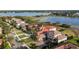 Stunning aerial view showcasing luxurious homes with manicured lawns and a beautiful lakefront community at 14724 Avenue Of The Rushes, Winter Garden, FL 34787