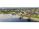 Aerial view of a neighborhood with a mix of well-maintained homes, lake access, and private docks creating an inviting community at 14724 Avenue Of The Rushes, Winter Garden, FL 34787