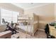Bedroom with bunk beds and a large window that provides natural light at 14724 Avenue Of The Rushes, Winter Garden, FL 34787