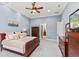 Bedroom featuring a ceiling fan, and an ensuite bathroom visible through a doorway at 14724 Avenue Of The Rushes, Winter Garden, FL 34787