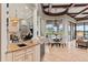 Bright breakfast nook with views of the lake and access to the living room at 14724 Avenue Of The Rushes, Winter Garden, FL 34787