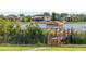 Picturesque dock and gazebo overlooking the serene lake, surrounded by lush greenery at 14724 Avenue Of The Rushes, Winter Garden, FL 34787