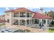 Beautiful two-story home with a red tile roof, a luxurious pool, and outdoor entertainment areas at 14724 Avenue Of The Rushes, Winter Garden, FL 34787