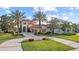 Beautiful exterior elevation of the home features lush landscaping and a circular driveway at 14724 Avenue Of The Rushes, Winter Garden, FL 34787