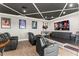 Home theater room with tiered seating and a large screen at 14724 Avenue Of The Rushes, Winter Garden, FL 34787