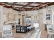 Gourmet kitchen with custom cabinets, granite counters, stainless steel appliances, and a center island at 14724 Avenue Of The Rushes, Winter Garden, FL 34787