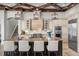 Gourmet kitchen with a large island, stainless steel appliances, and custom cabinetry at 14724 Avenue Of The Rushes, Winter Garden, FL 34787
