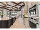 Open kitchen featuring a large island, stainless steel appliances, and access to the living room at 14724 Avenue Of The Rushes, Winter Garden, FL 34787