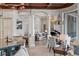 Spacious living area with a wet bar, pillars, and view into the living room at 14724 Avenue Of The Rushes, Winter Garden, FL 34787