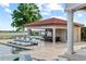 Poolside bar and lounge area with comfortable seating and outdoor dining, perfect for entertaining at 14724 Avenue Of The Rushes, Winter Garden, FL 34787