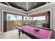 Pool table overlooking the terrace with beautiful lake view at 14724 Avenue Of The Rushes, Winter Garden, FL 34787