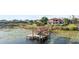 Beautiful waterfront house with a private boat dock and lift, nestled among serene lily pads on the lake at 14724 Avenue Of The Rushes, Winter Garden, FL 34787