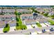 Aerial view of townhomes showing garages, driveways, and solar panels in a residential community at 15030 Book Club Rd, Winter Garden, FL 34787