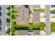 Aerial view of townhomes with manicured lawns, private patios, and neat neighborhood streets at 15030 Book Club Rd, Winter Garden, FL 34787