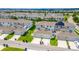 Aerial view of townhomes featuring attached garages and a well-maintained residential street at 15030 Book Club Rd, Winter Garden, FL 34787