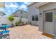 Paver patio with outdoor seating and white fence creating a private backyard space at 15030 Book Club Rd, Winter Garden, FL 34787
