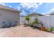 Cozy backyard patio featuring brick pavers, privacy fence, and pleasant landscaping, creating a relaxing outdoor living space at 15030 Book Club Rd, Winter Garden, FL 34787