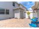 A backyard patio with blue outdoor seating, garden boxes, and a white privacy fence at 15030 Book Club Rd, Winter Garden, FL 34787
