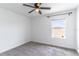 Neutral bedroom features carpet and a window with lovely natural light at 15030 Book Club Rd, Winter Garden, FL 34787