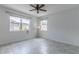 Bright and airy bedroom with tile floors, ceiling fan, and large windows offering natural light at 15030 Book Club Rd, Winter Garden, FL 34787