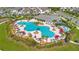 An inviting community pool with palm trees, lounge chairs, and a covered pavilion area at 15030 Book Club Rd, Winter Garden, FL 34787