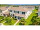 Beautiful two-story home with a well-kept lawn, lush landscaping, and an inviting front porch at 15030 Book Club Rd, Winter Garden, FL 34787