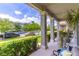 Inviting front porch with stately columns and comfortable seating, offering a relaxing outdoor space at 15030 Book Club Rd, Winter Garden, FL 34787