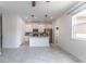 Open concept kitchen features white cabinets, stainless steel appliances and tiled floors at 15030 Book Club Rd, Winter Garden, FL 34787