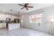 Bright kitchen boasts white cabinets, modern stainless steel appliances, and tiled floors at 15030 Book Club Rd, Winter Garden, FL 34787