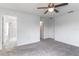 Bright, carpeted primary bedroom showing ensuite bathroom and closet doors at 15030 Book Club Rd, Winter Garden, FL 34787