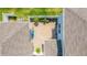 A private patio featuring a paver surface, seating, and garden area surrounded by a white fence at 15030 Book Club Rd, Winter Garden, FL 34787