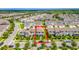 Aerial view of a traditional two story home with landscaping in a residential neighborhood at 15030 Book Club Rd, Winter Garden, FL 34787