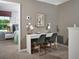 Comfortable home office space with a modern desk, decor, and ample natural light at 16382 Bird Of Paradise Ave, Clermont, FL 34714