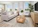 Inviting living room with large windows, stylish furniture, and a comfortable seating arrangement at 16382 Bird Of Paradise Ave, Clermont, FL 34714