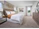 Spacious main bedroom with carpet, large windows, and elegant decor at 16382 Bird Of Paradise Ave, Clermont, FL 34714