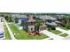 Stunning aerial view showcasing home with solar panels, lush landscaping and neighborhood pond at 1902 Hailsham Ct, Orlando, FL 32824