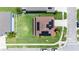 Aerial view of a home with solar panels, a spacious backyard, modern fence, and manicured landscaping in a desirable neighborhood at 1902 Hailsham Ct, Orlando, FL 32824