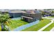 Beautiful backyard features a well-maintained lawn, modern fence, and solar panels on the roof for energy efficiency at 1902 Hailsham Ct, Orlando, FL 32824