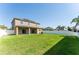 Expansive backyard featuring a well-maintained lawn, privacy fencing, and ample space at 1902 Hailsham Ct, Orlando, FL 32824