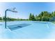 Outdoor basketball court with nets and clear blue surface available within the community amenities at 1902 Hailsham Ct, Orlando, FL 32824