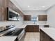 Well-equipped kitchen featuring stainless steel appliances, and ample counter space at 1902 Hailsham Ct, Orlando, FL 32824