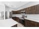 Contemporary kitchen showcases modern appliances, stylish wood cabinetry, and quartz counters at 1902 Hailsham Ct, Orlando, FL 32824