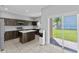 Modern kitchen with dark wood cabinets, quartz countertops, and stainless steel appliances at 1902 Hailsham Ct, Orlando, FL 32824