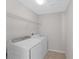This is a laundry room with a washer and dryer, and wire shelving at 1902 Hailsham Ct, Orlando, FL 32824