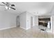 Expansive open living area with tile flooring, neutral walls, and abundant natural light at 1902 Hailsham Ct, Orlando, FL 32824