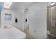 Bright bathroom with a shower, toilet, vanity, mirror, and towel racks at 200 Palm Meadows Dr, Eustis, FL 32726