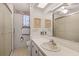 Bathroom with a white sink, floral border, and walk-in shower at 200 Palm Meadows Dr, Eustis, FL 32726