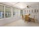 Dining space featuring ample natural light, neutral carpeting, wooden chairs, and a round table at 200 Palm Meadows Dr, Eustis, FL 32726